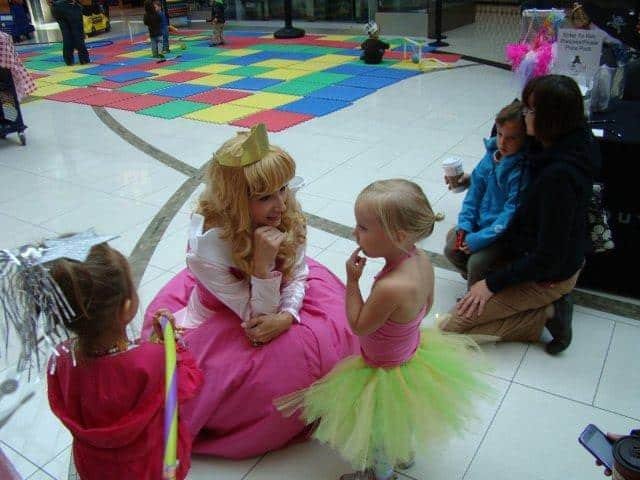 Princess Sleeping Beauty chatting with star struck toddler at Calgary Southcentre Mall Princess Sleeping Beauty chatting with star struck toddler at Calgary Southcentre Mall