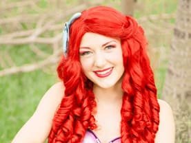 Mermaid Princess with her red hair loves seashells and sea life and parties under the sea