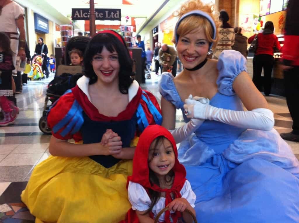 Princess Snow White and Princess Cinderella posing with the famous Little Red Riding Hood at Northland Village Mall Halloween Celebration