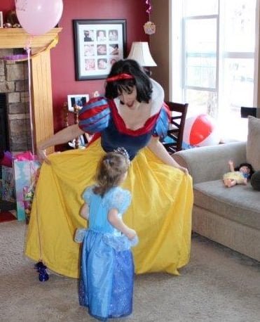 Princess Snow White dancing with birthday girl princess