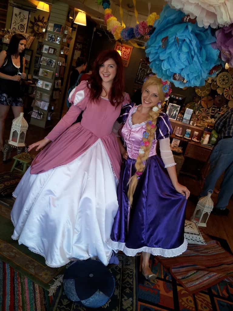 Princess Rapunzel and Princess Little Mermaid in her Pink Gown at Ten Thousand Villages Tea Party celebrating Princesses from Around the World