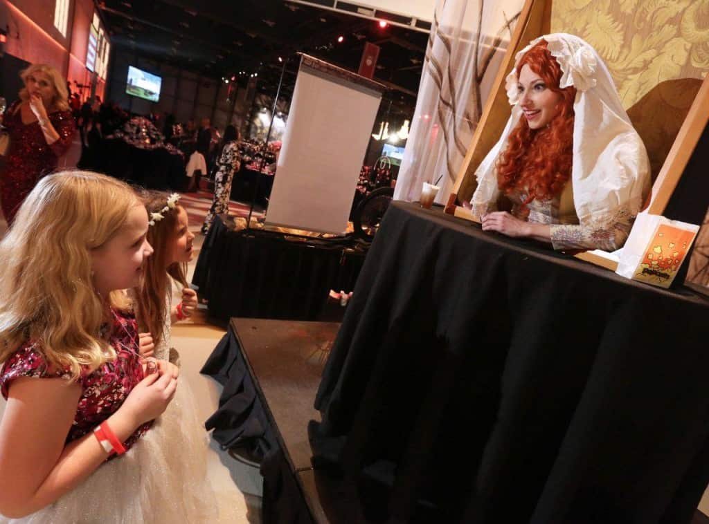 Calgary Fat Lady Inspired Painting interacting with kids at Candy Cane Gala