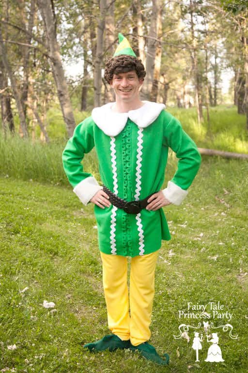 Green and yellow Christmas elf with elf shoes and curly hair.